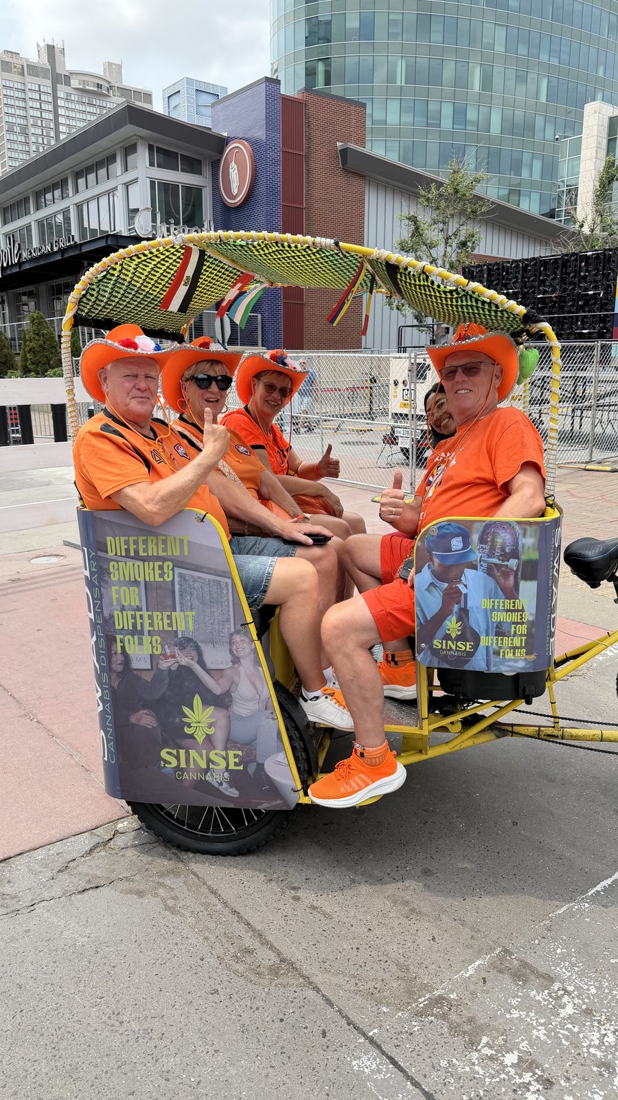 Happy riders aboard an EZ pedicab